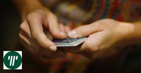 A person holding credit cards