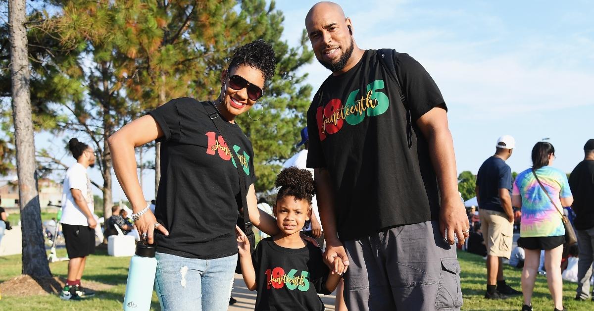 A family wearing t-shirt for Juneteenth