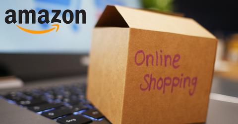 Amazon logo, laptop, and cardboard box