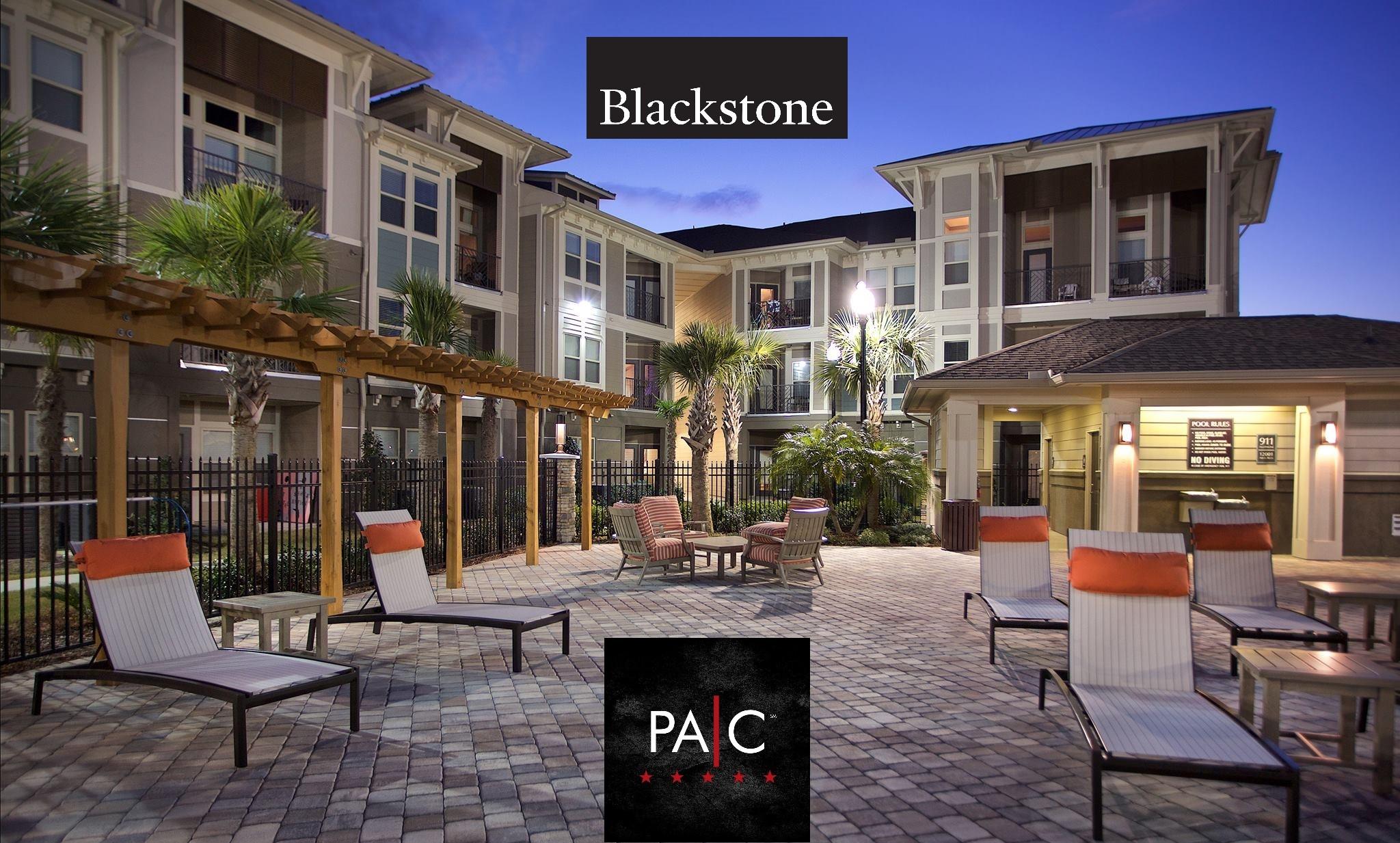 Blackstone and PAC logo over image of apartment building patio