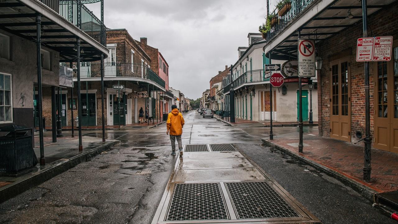 Man walking through the French Quarter before Hurricane Ida