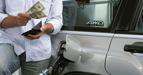 A person paying for gas at the pump