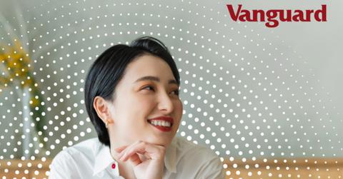 Women with Vanguard logo in background