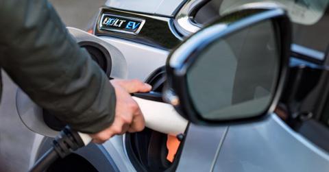 Man charging a Bolt EV