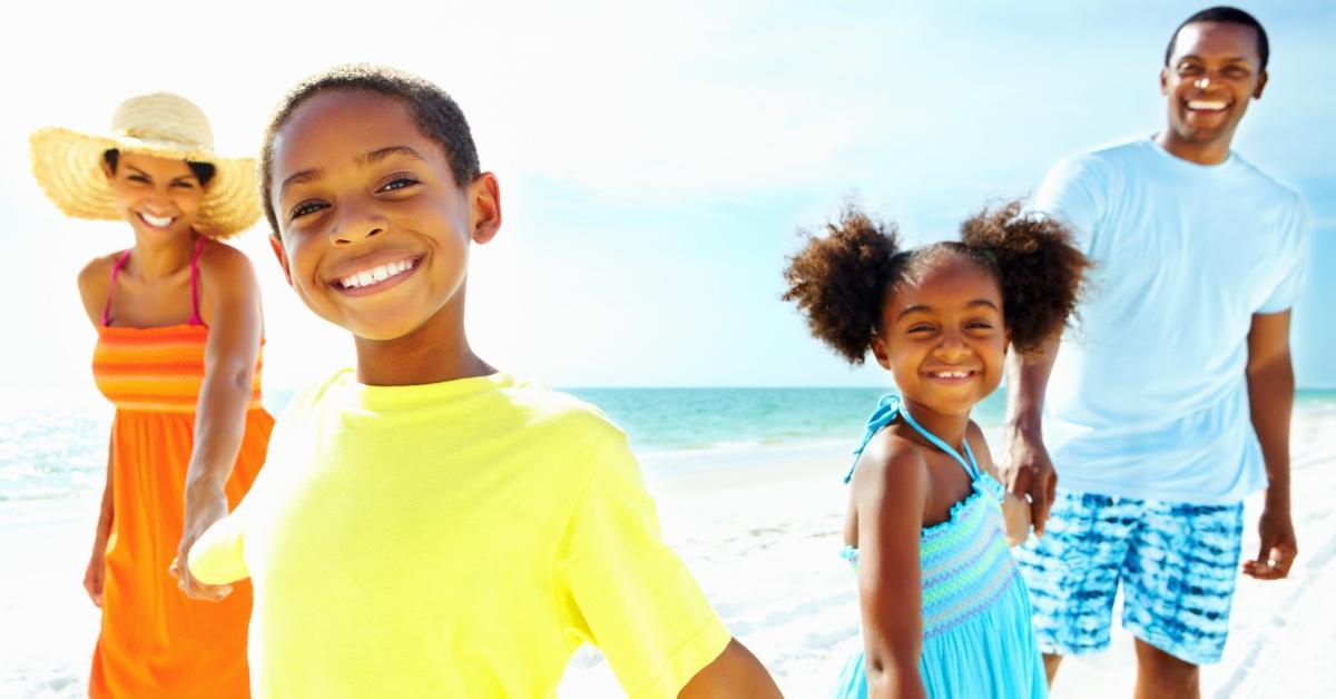 Family vacationing on the beach