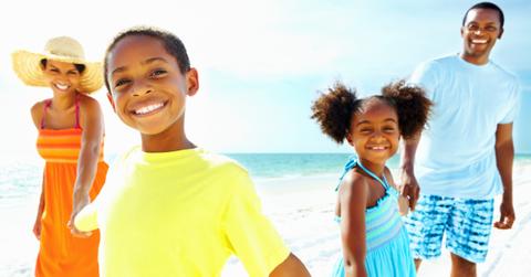 Family vacationing on the beach
