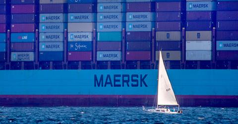 a cargo ship waits in the water to dock at the Port of Long Beach.
