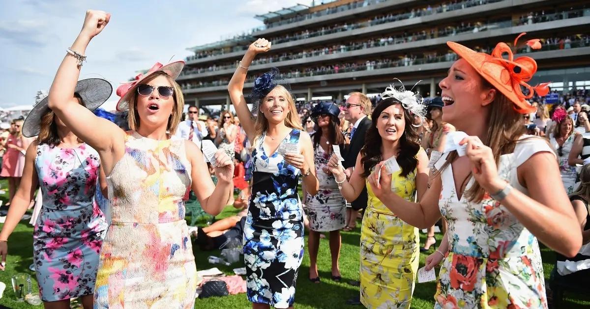 Kentucky Derby fans cheering on the field.