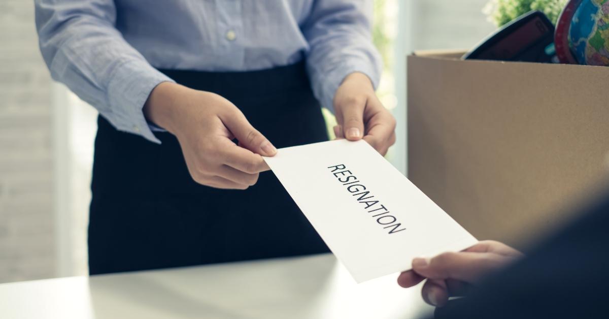 employee handing over letter of resignation