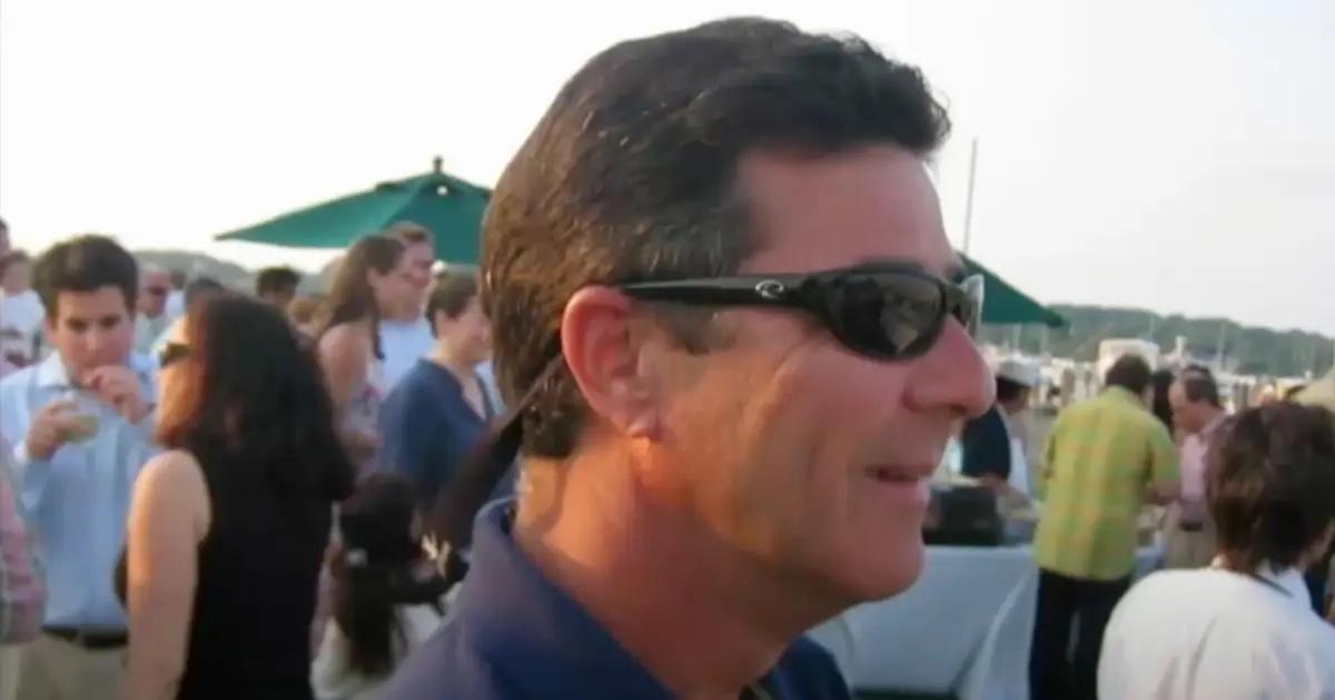 Frank DiPascali Jr. attends an outside event wearing a polo and sunglasses.