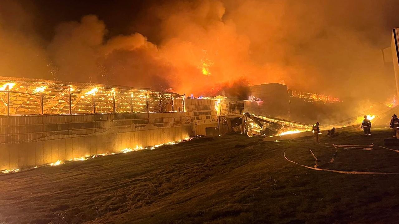 Firefighters battle the fire at Forsman Farms 