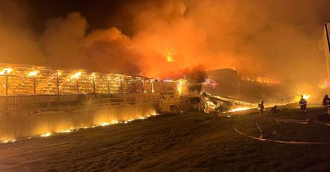 Firefighters battle the fire at Forsman Farms