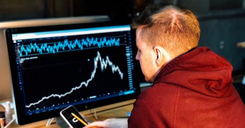 A man looking at buffer ETF data