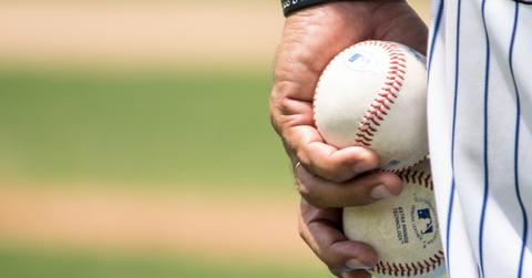Pitcher holding baseballs
