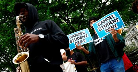 Cancel student debt signs at protest