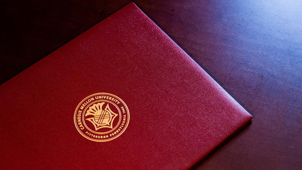 Maroon Carnegie Mellon diploma holder