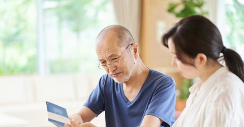 Parent and child looking at the passbook