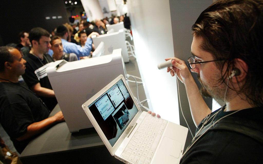 A person using a laptop at a tech event