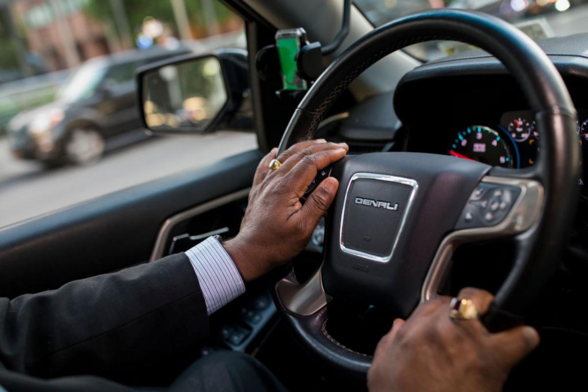 A man driving an SUV