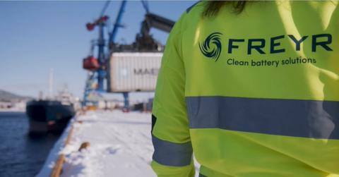 A person wearing a FREYR uniform