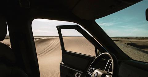 An interior shot of a Rivian car in a desert