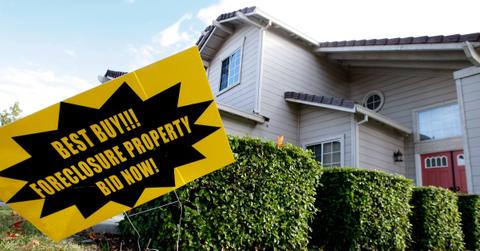 Foreclosure sign on property lawn