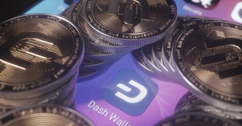 The Dash Wallet logo amid coins