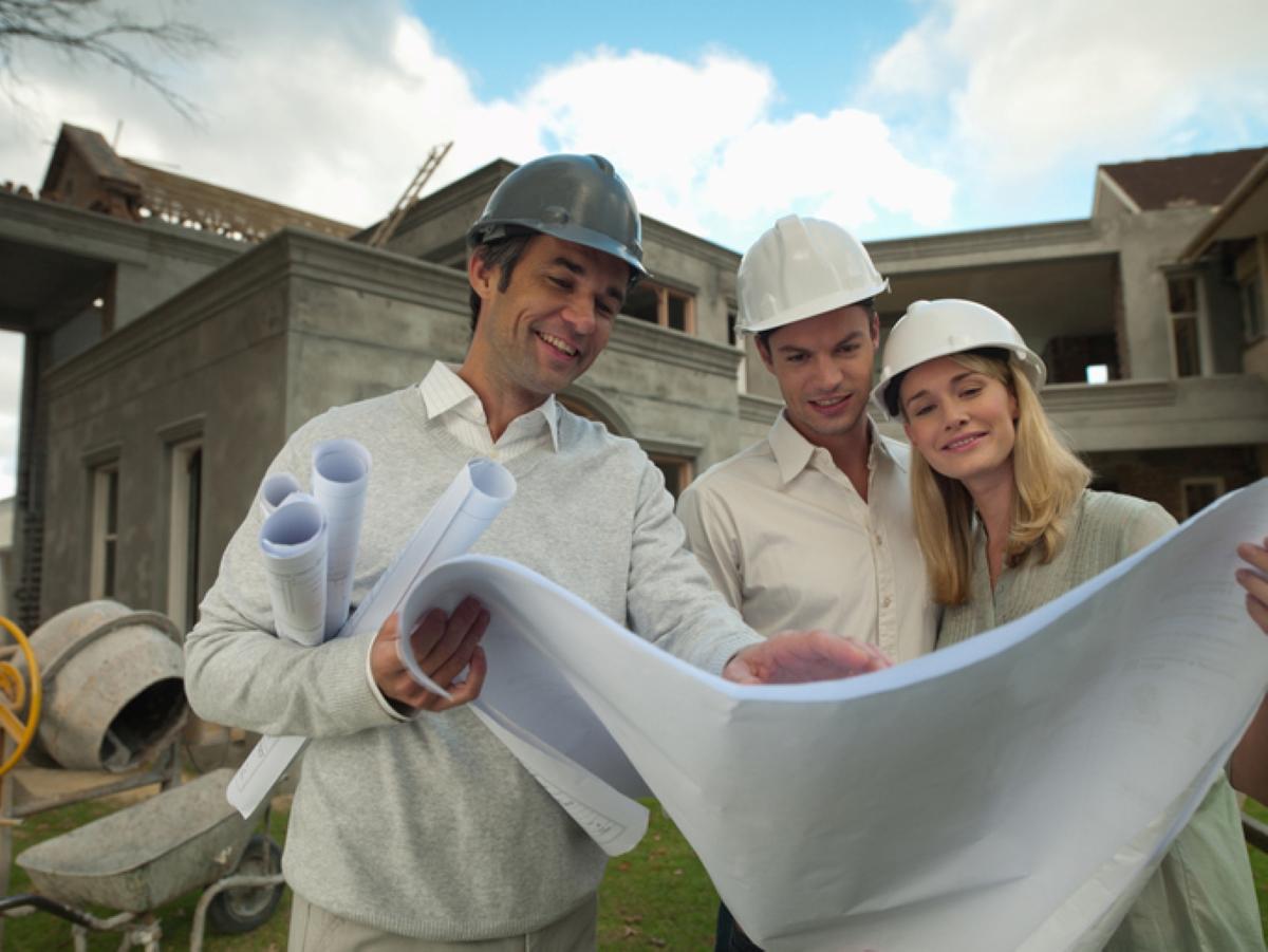 Family looks at home blueprints