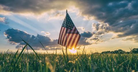 An American flag in a grass field