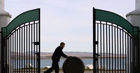 Man rolling barrel of oil