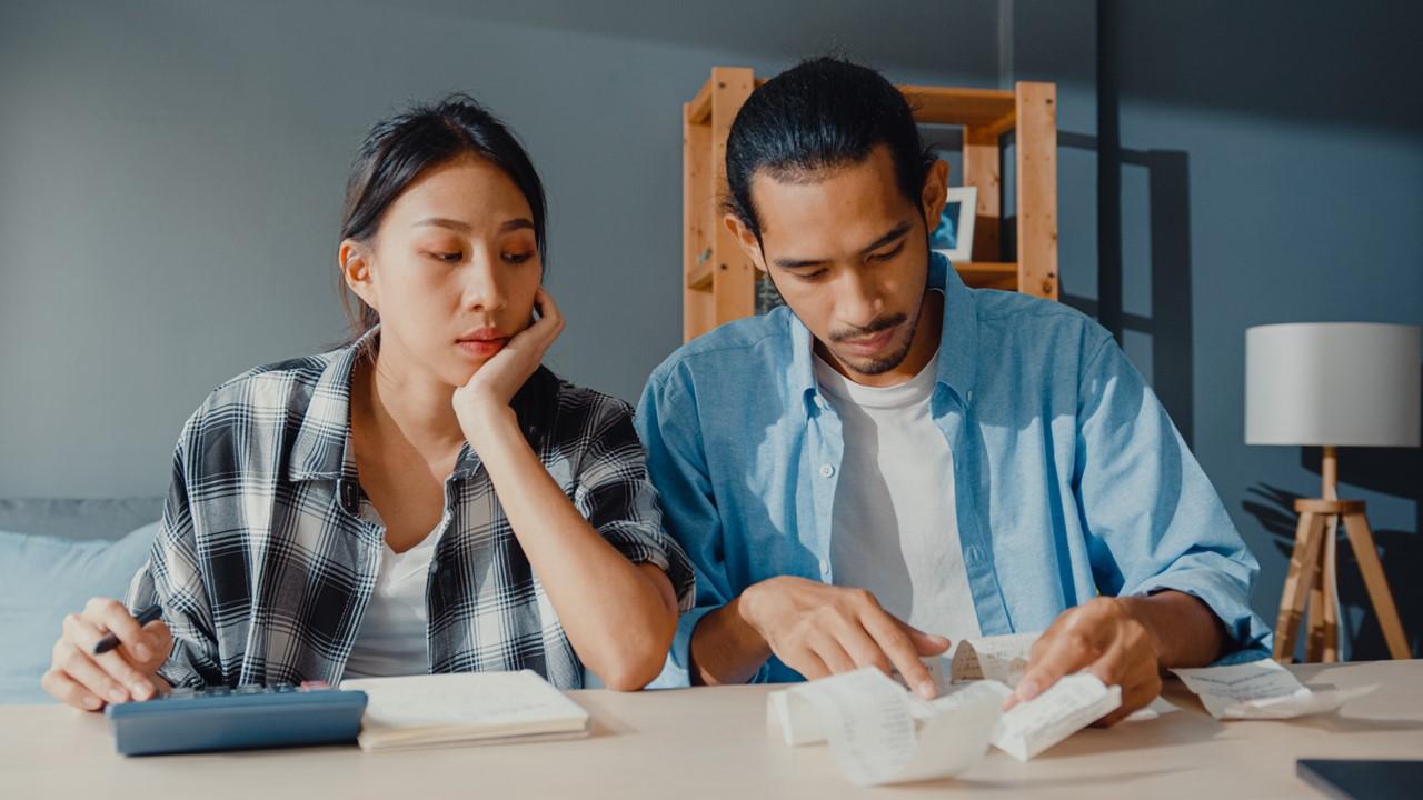 A couple looking at bills