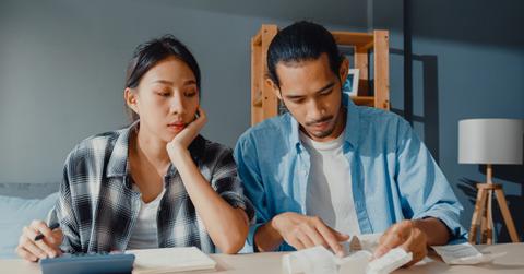 A couple looking at bills