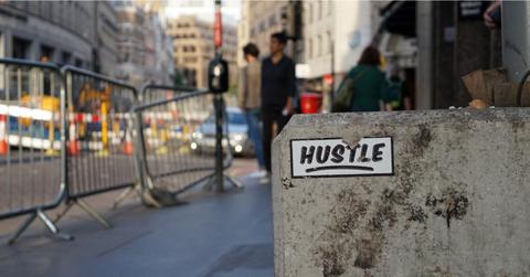 hustle sticker on concrete