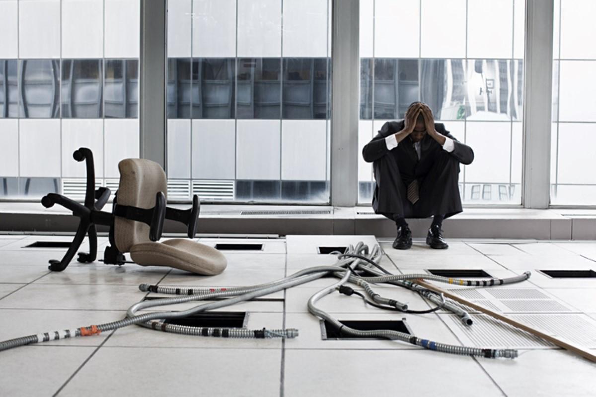 Despaired business man in an empty office