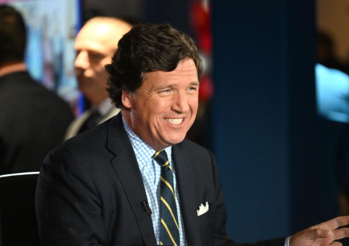 Tucker Carlson smiling at the FOX Nation Patriot Awards in November 2022