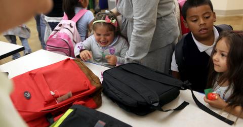 Kids getting free bags from one-for-one companies