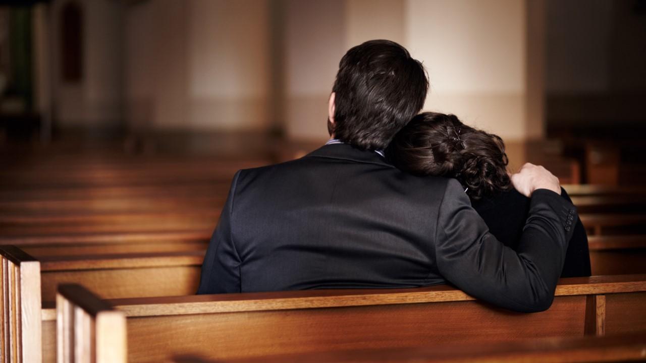 A couple at a funeral