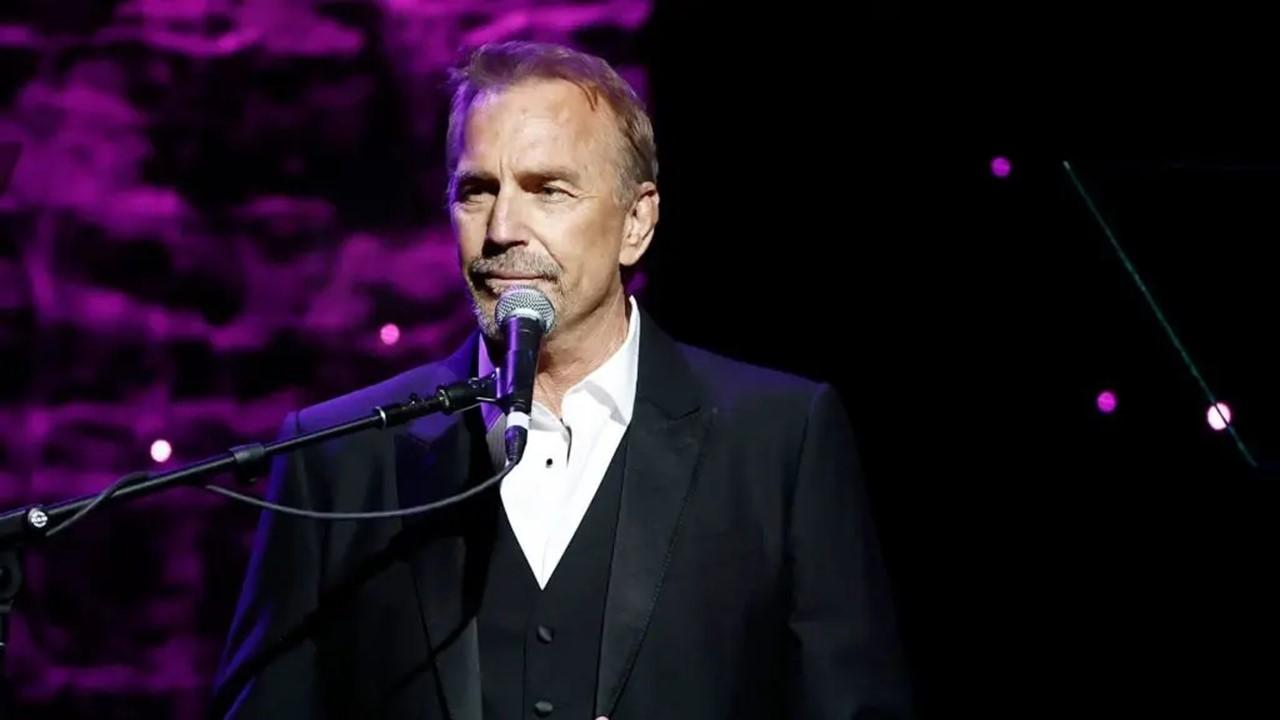 Kevin Costner in a black suit at the Pre-Grammy Gala