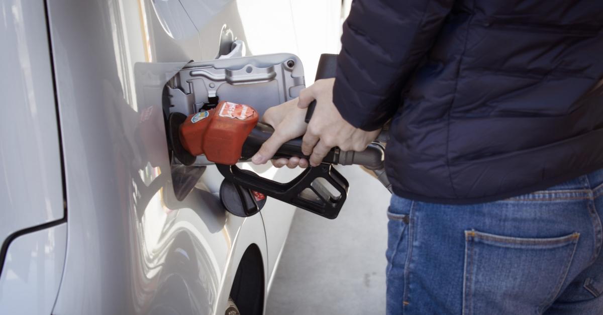 Man putting gas in a car