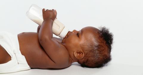 Baby drinking a bottle of formula