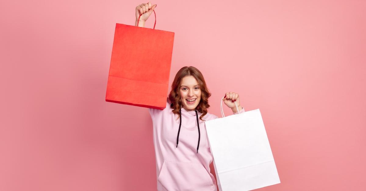 A teenage girl holding gifts