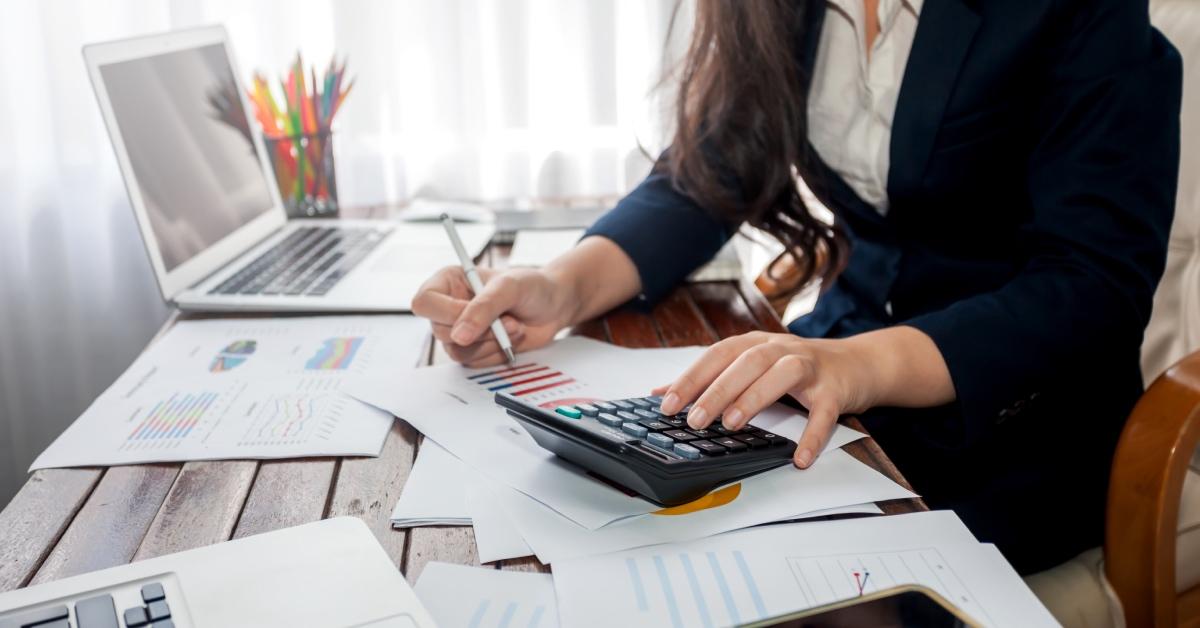 A business owner calculating her taxes.