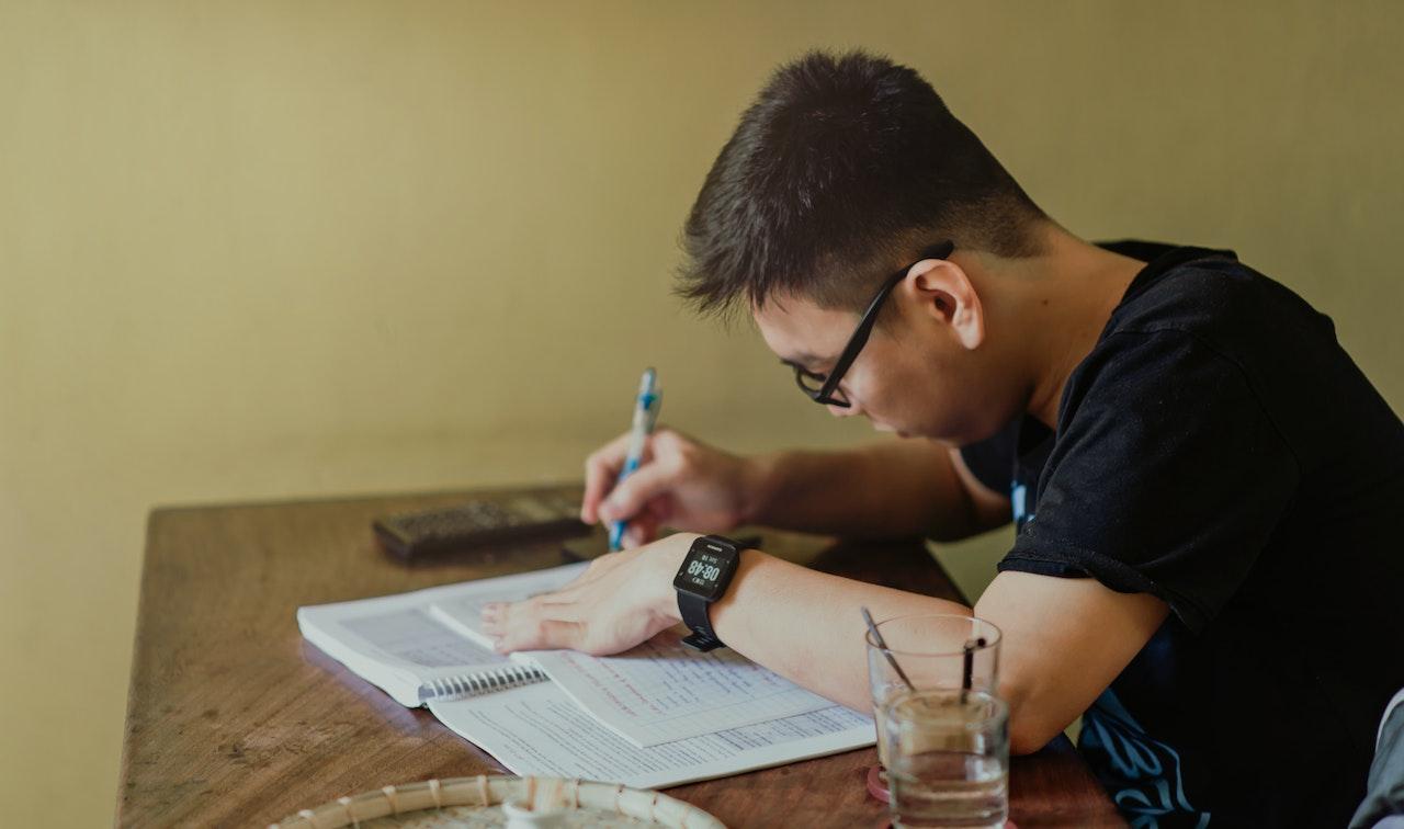 A college student studying at a desk