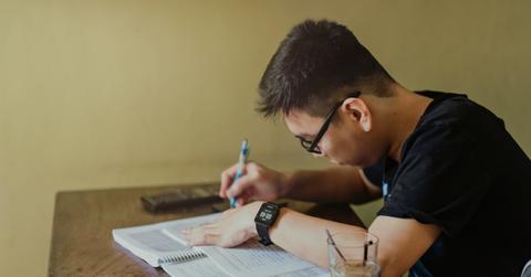 A college student studying at a desk