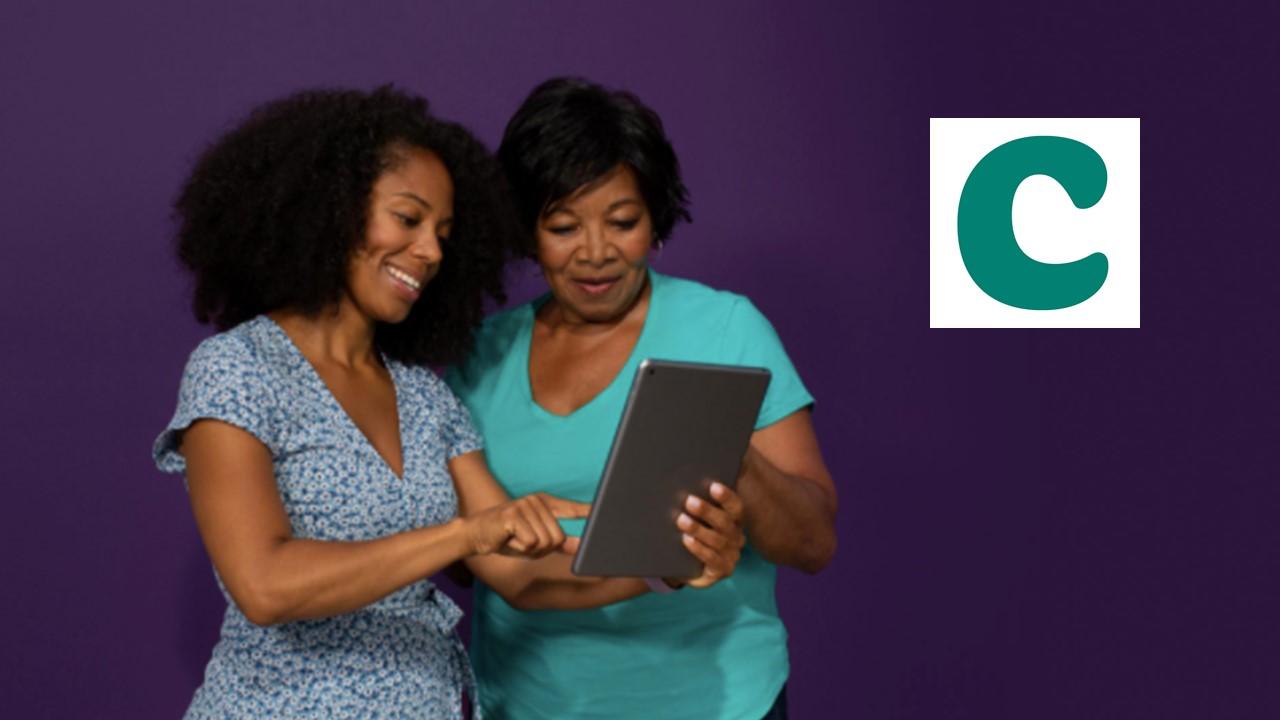 Women looking at a tablet and Clover Health logo