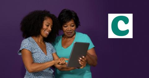 Women looking at a tablet and Clover Health logo