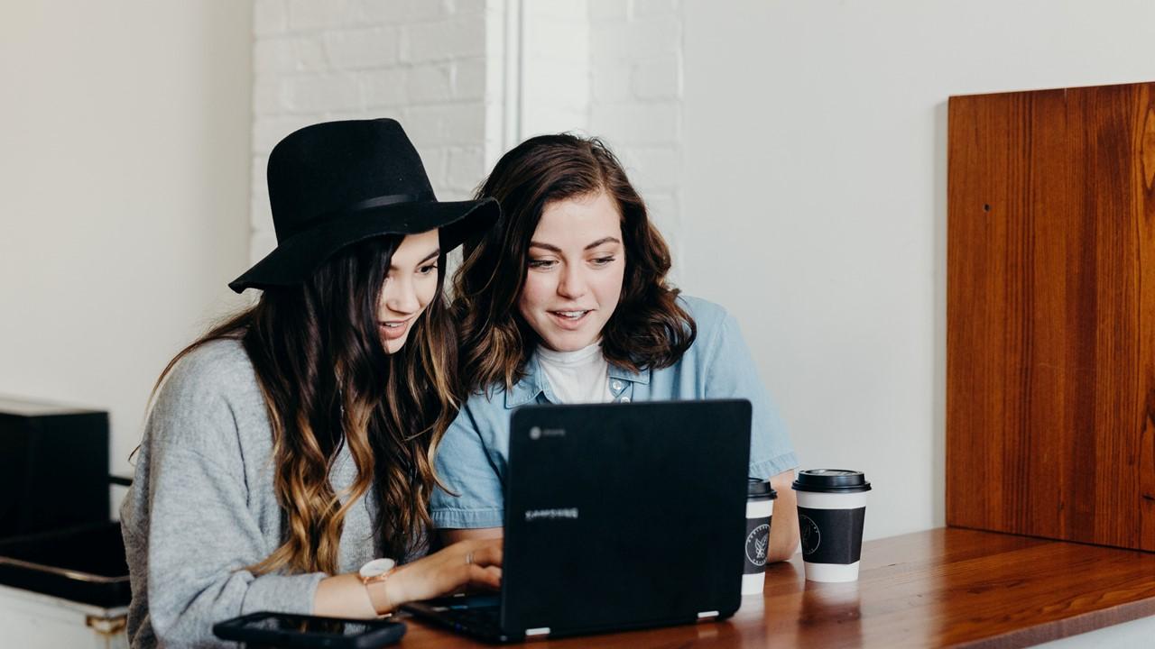 Two teen girls on computer