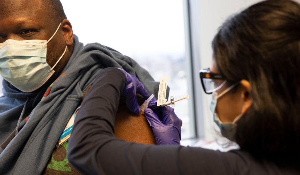 A man getting a COVID-19 vaccine