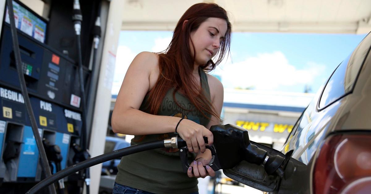 Woman pumping gas