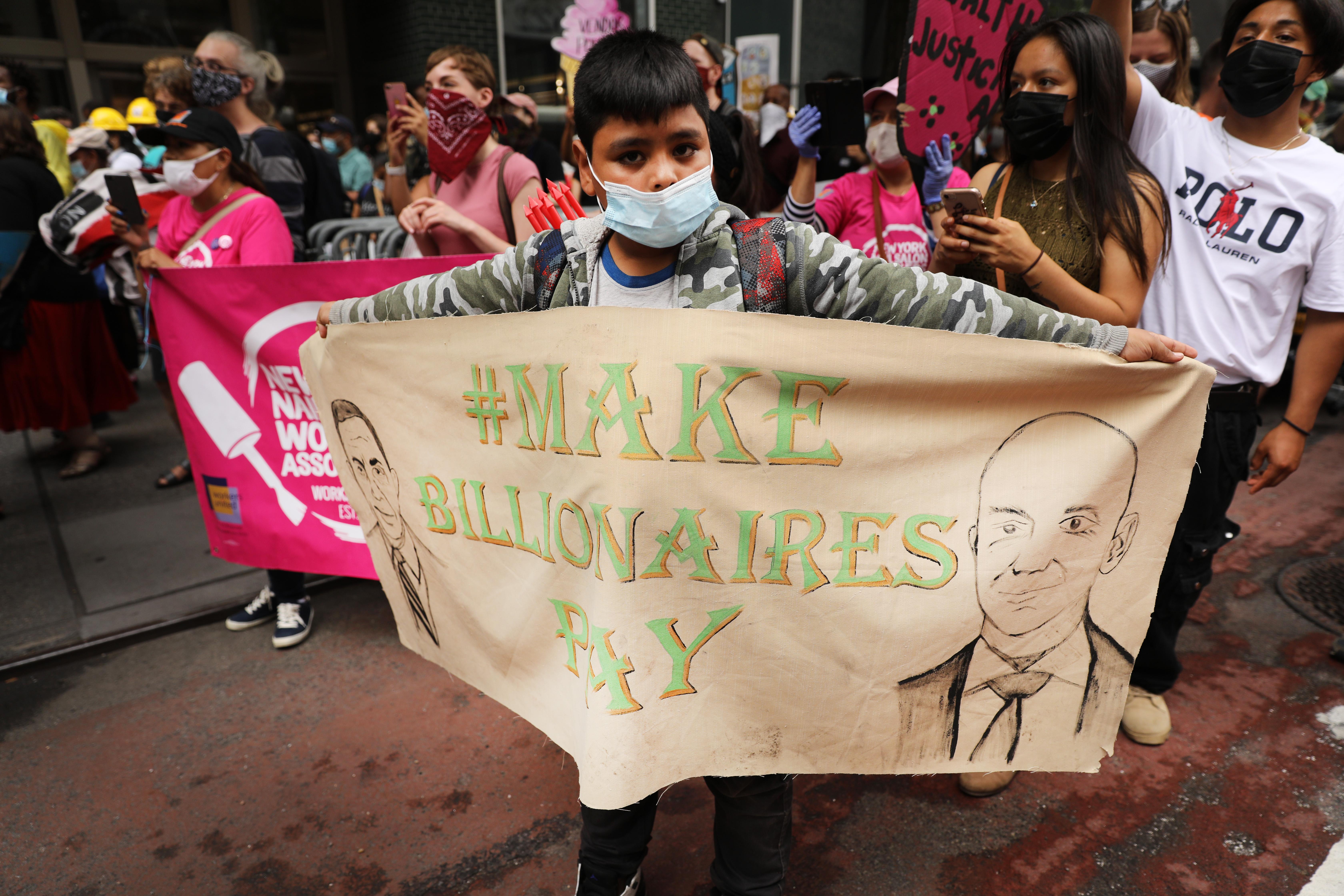 Activists march in Manhattan calling for a tax on billionaires